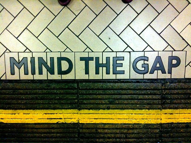 A picture of the warning "mind the gap" taken at a London tube station.